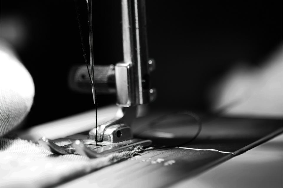 Close-up of a sewing machine needle in action.